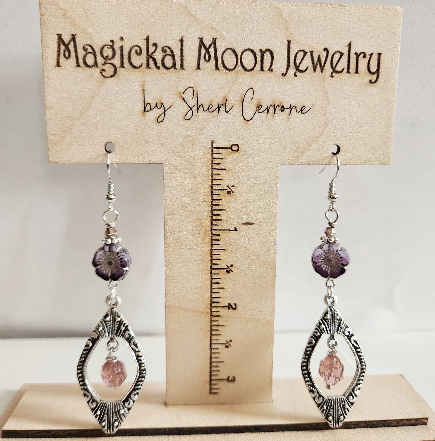 Silver ornate beaded dangle statement earrings