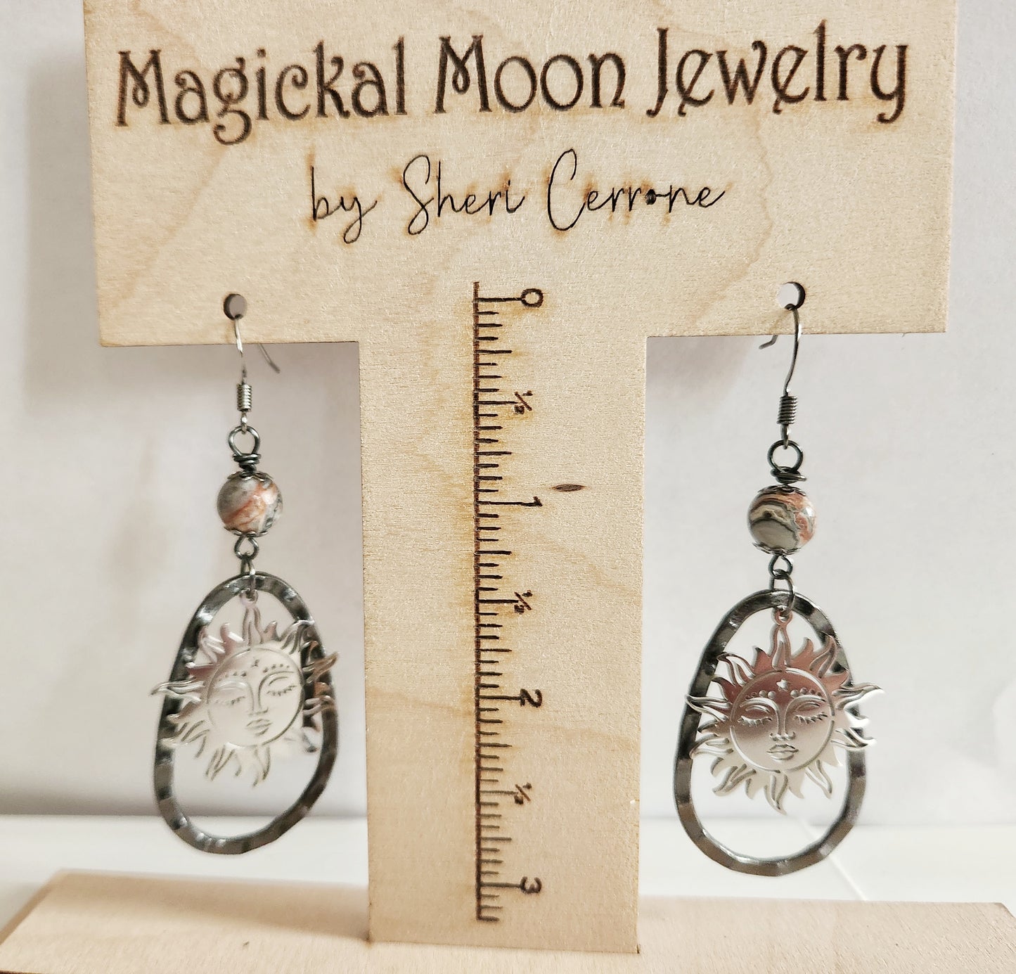 Silver sun dangle statement earrings