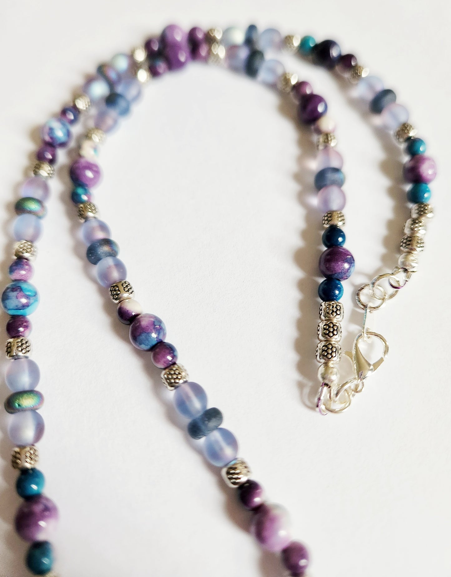 Silver dolphin and wave gemstone necklace