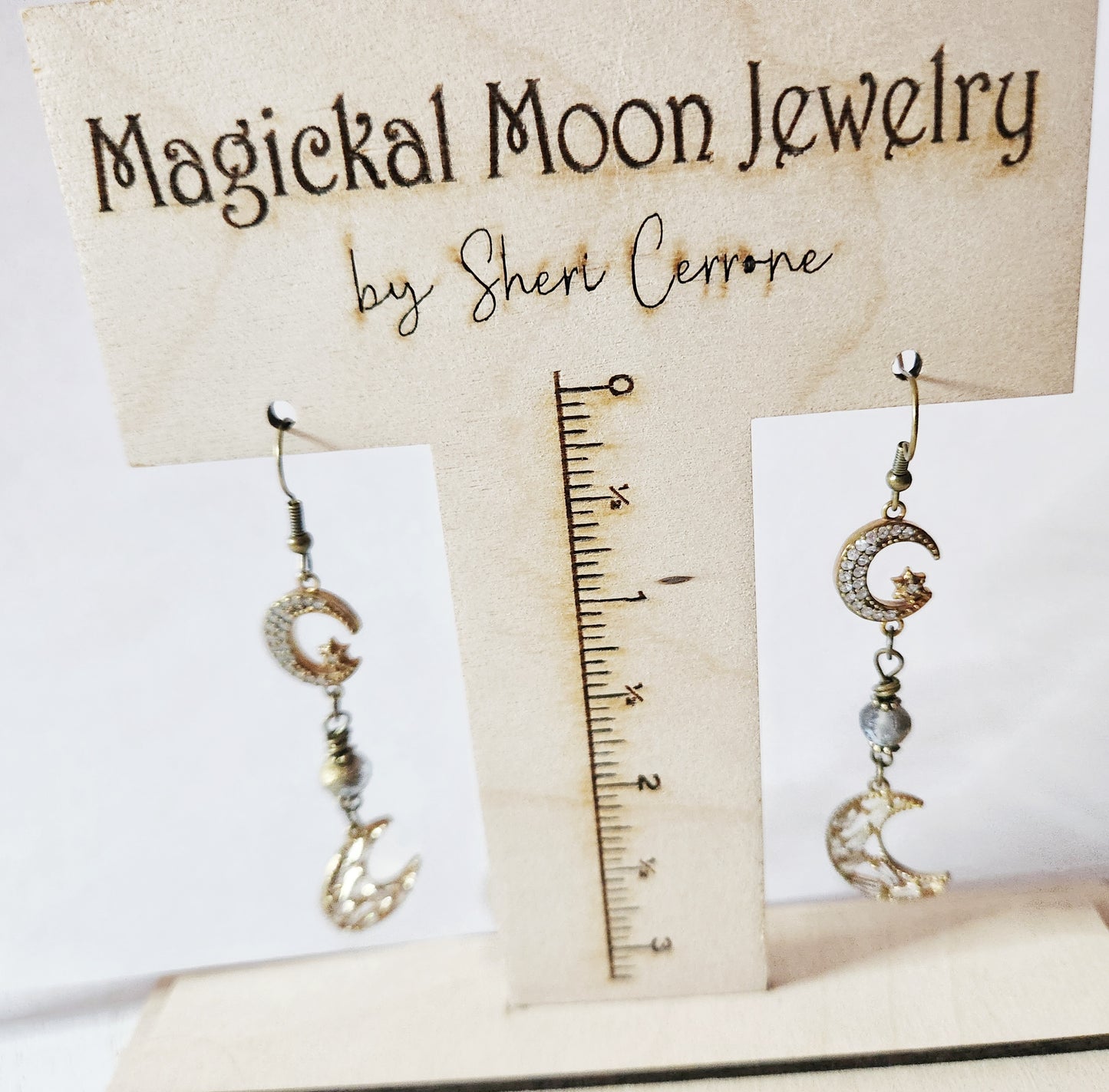 Dark gold crescent moon dangle earrings