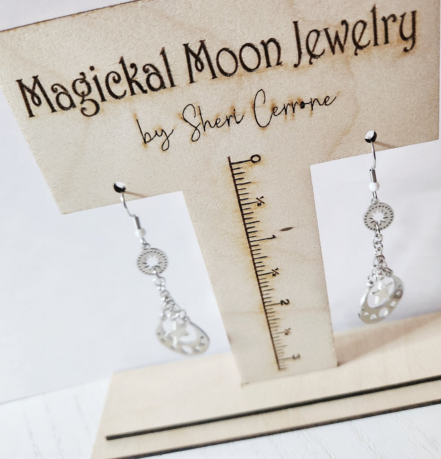 Silver moon phase dangle earrings