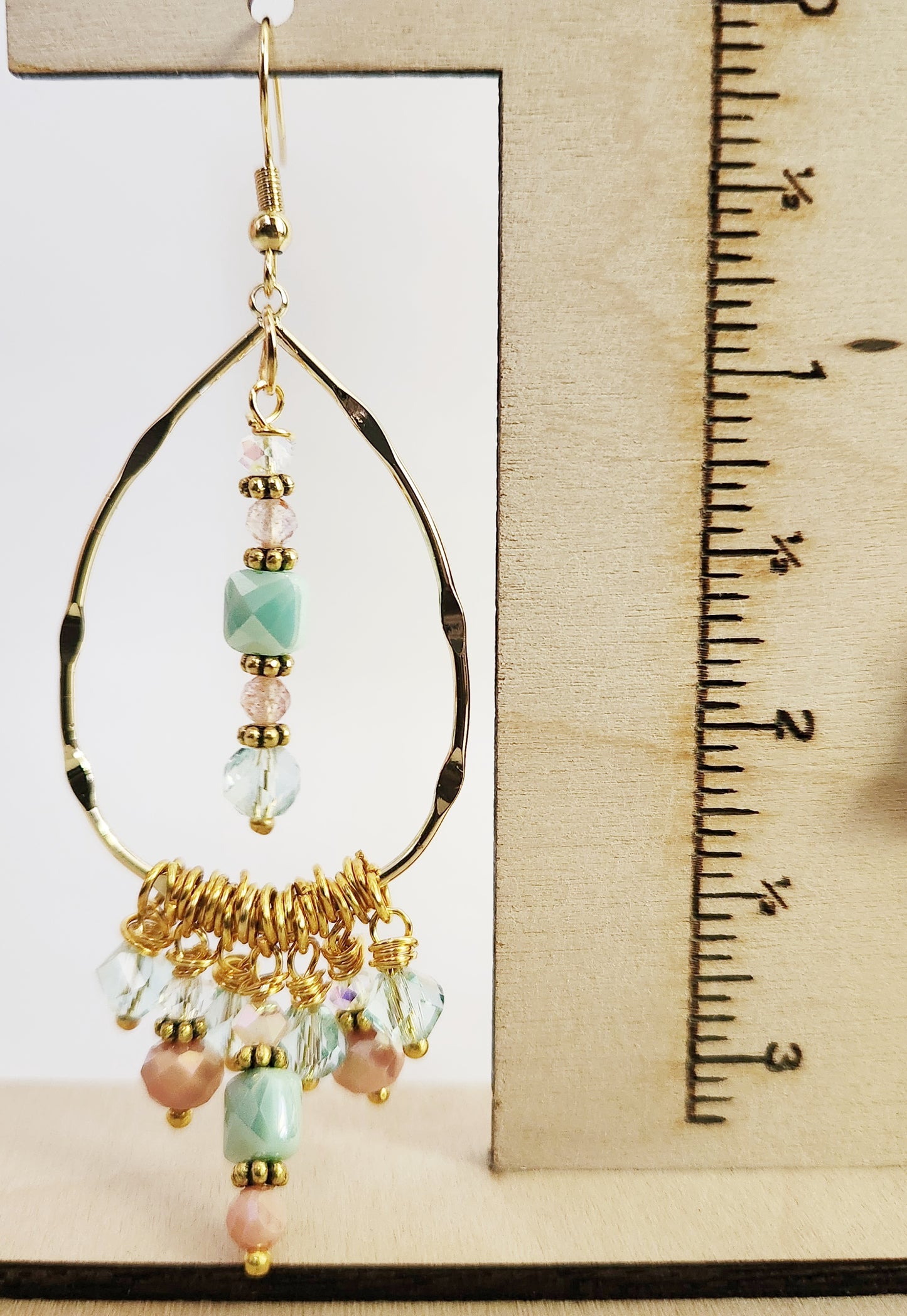 Gold beaded charm dangle statement earrings