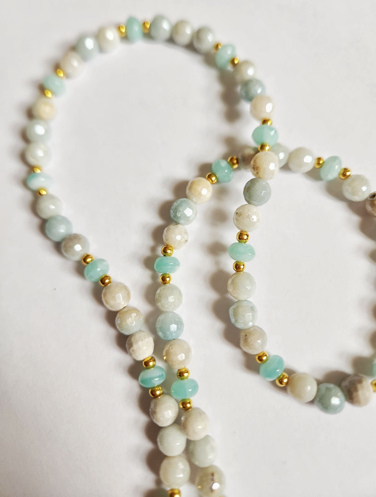 Gold charm gemstone necklace