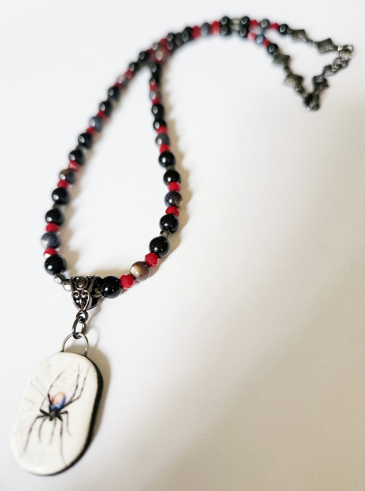 Dark silver spider gemstone necklace