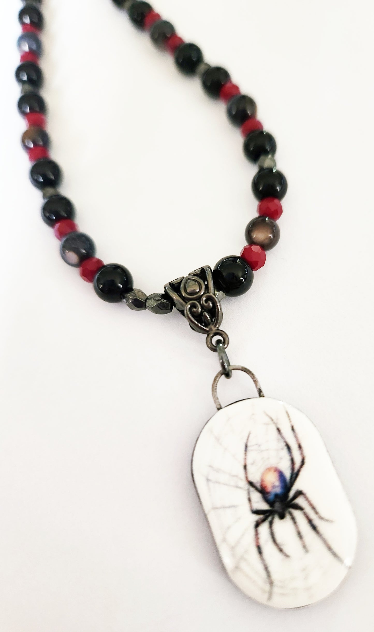 Dark silver spider gemstone necklace