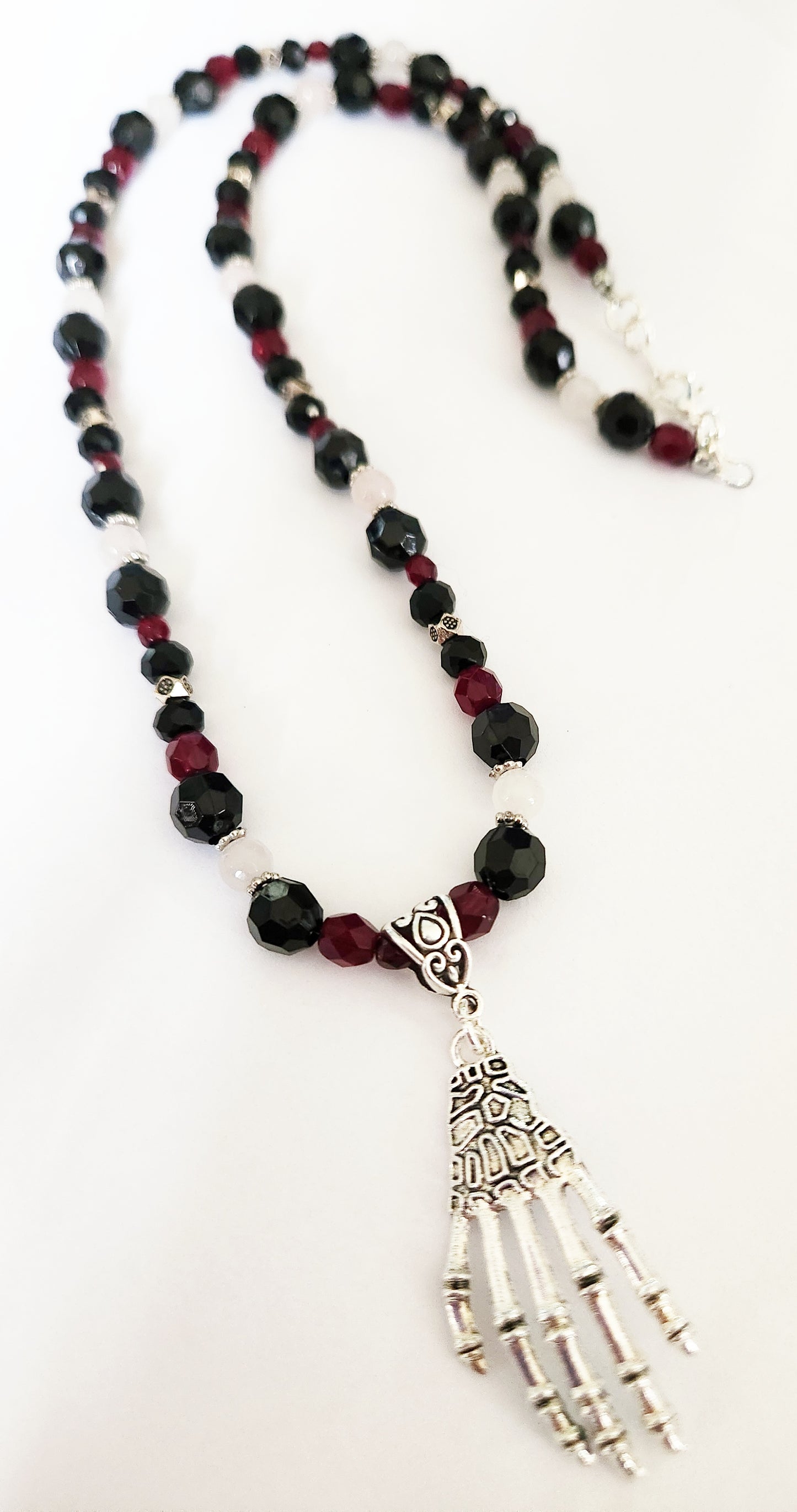 Silver skeleton hand Rose Quartz gemstone necklace