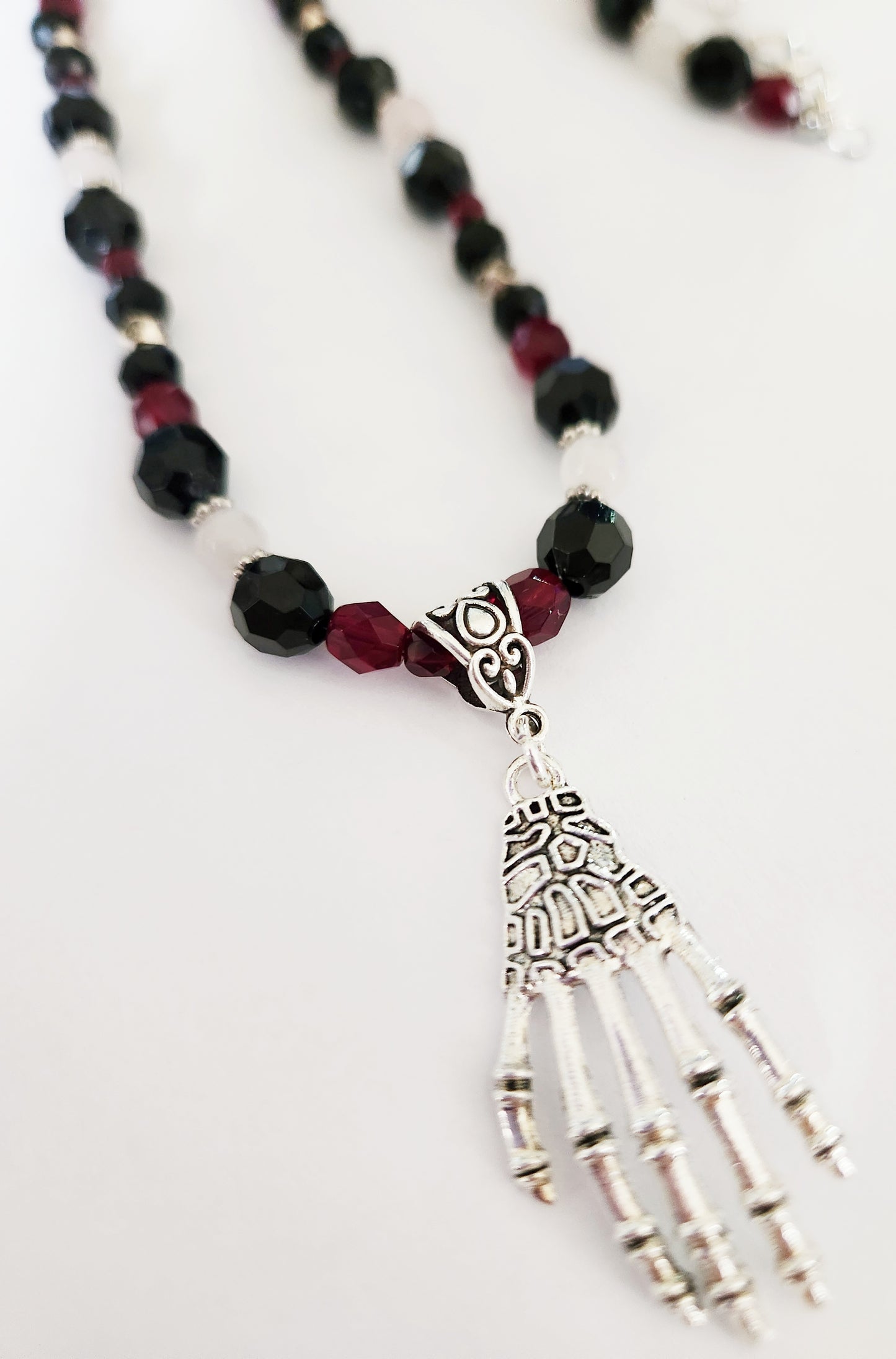 Silver skeleton hand Rose Quartz gemstone necklace