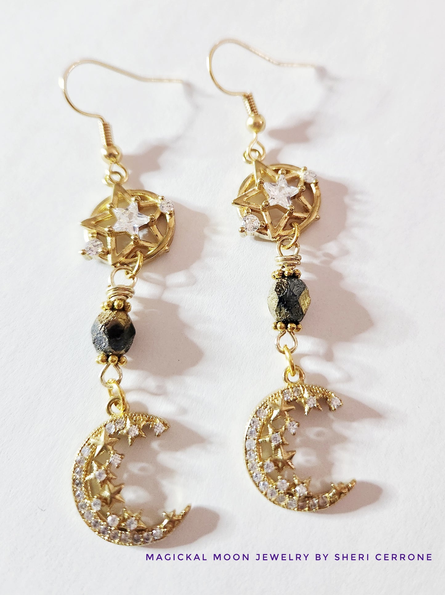 Gold crescent moon dangle earrings