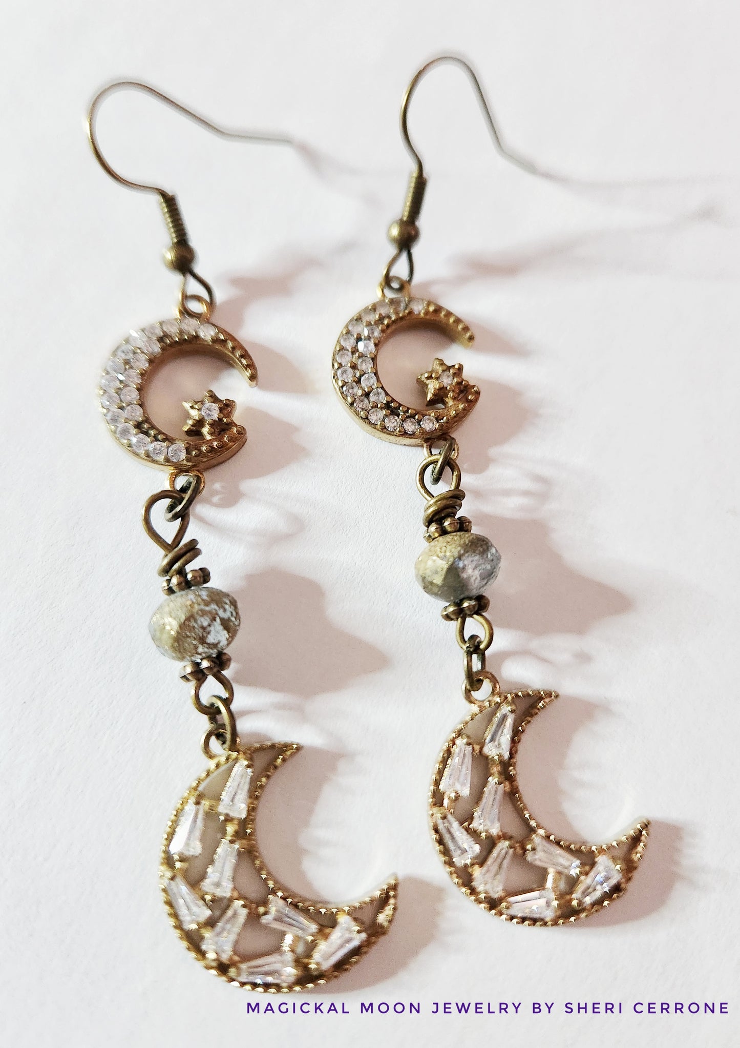 Dark gold crescent moon dangle earrings