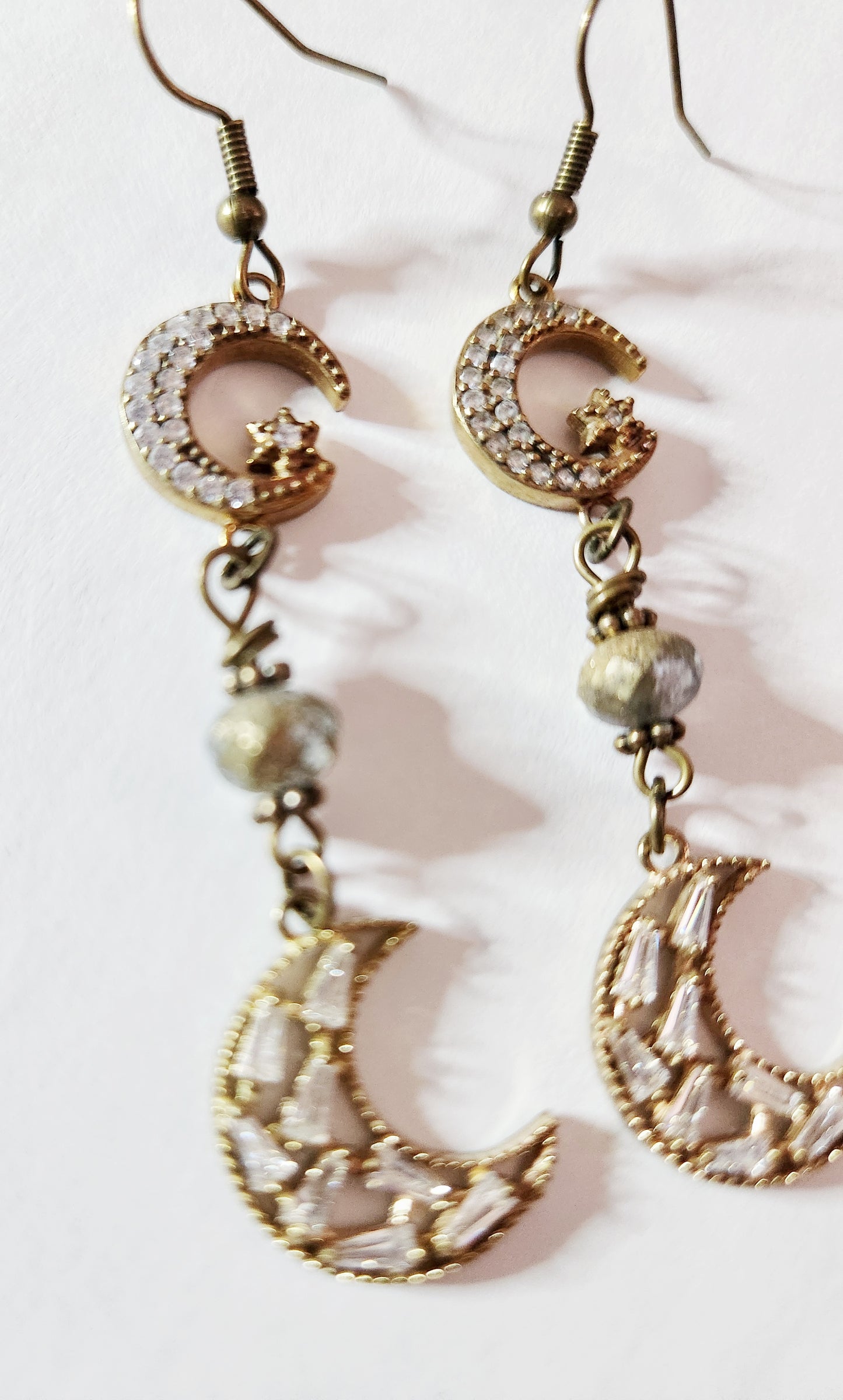 Dark gold crescent moon dangle earrings