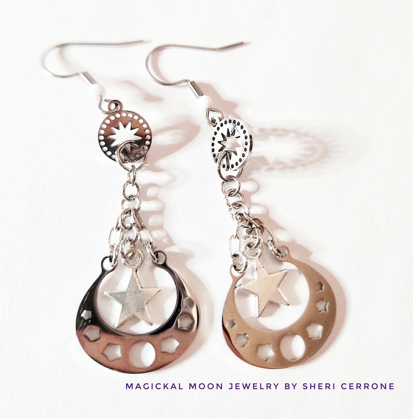 Silver moon phase dangle earrings