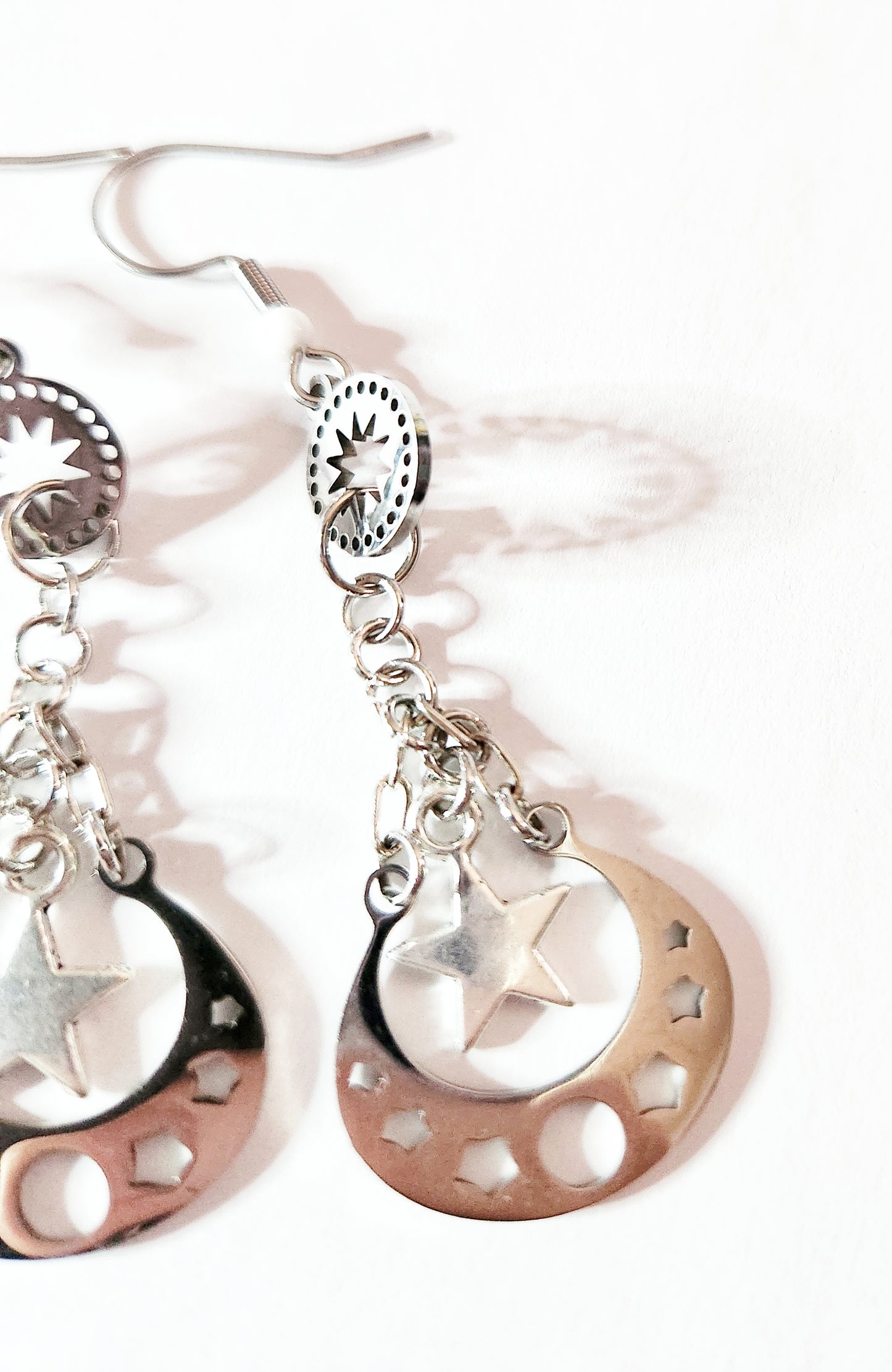Silver moon phase dangle earrings