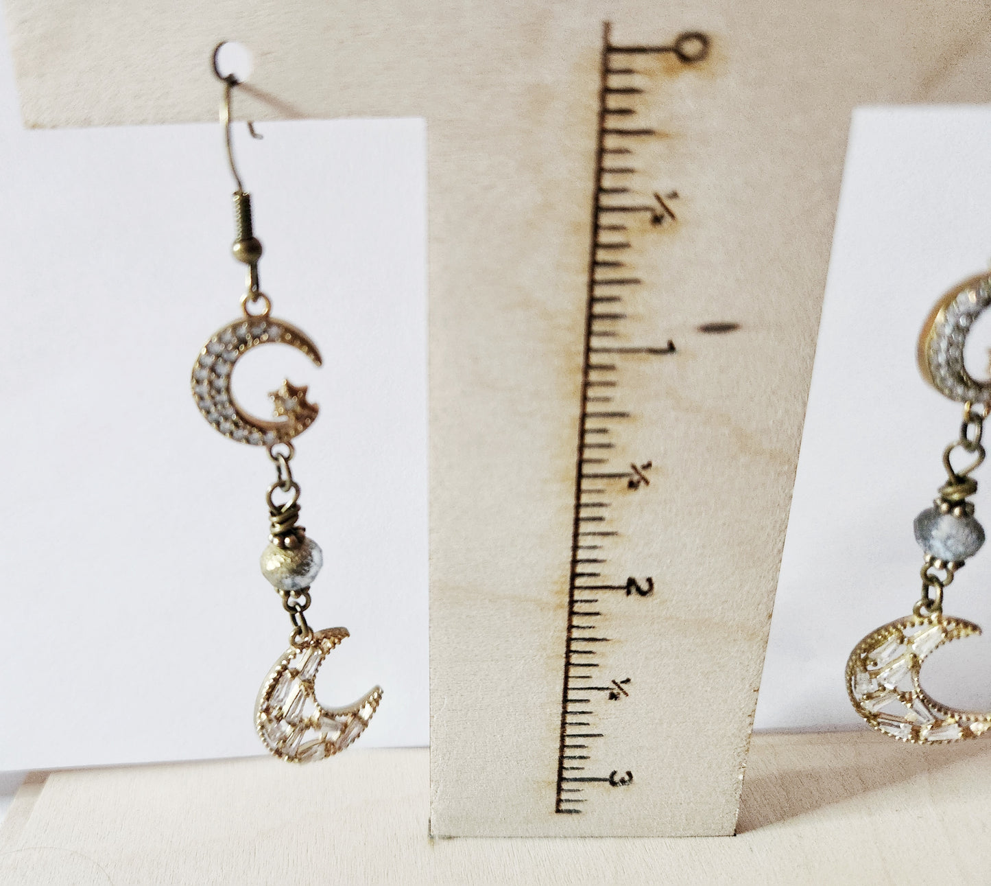 Dark gold crescent moon dangle earrings