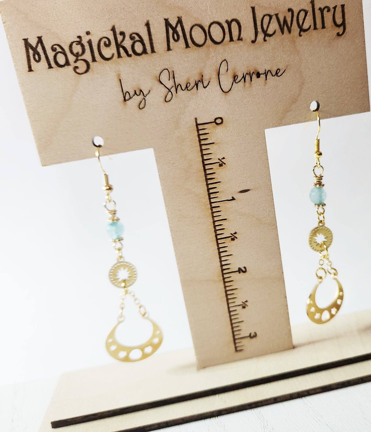 Gold moon phase dangle earrings