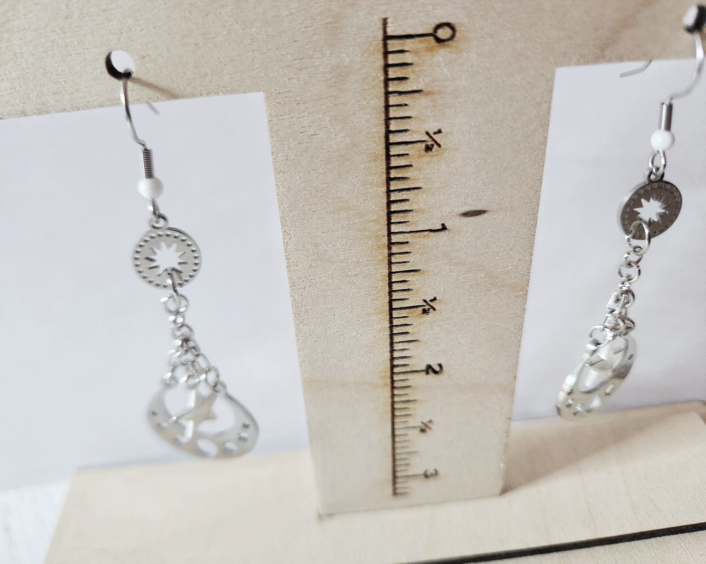 Silver moon phase dangle earrings