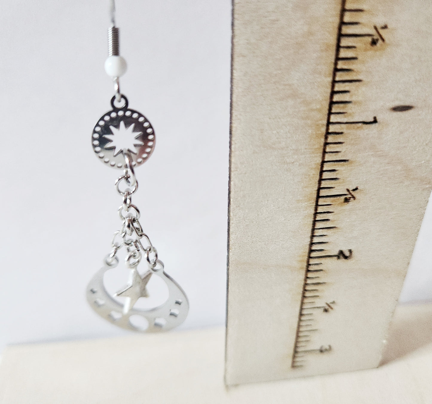 Silver moon phase dangle earrings