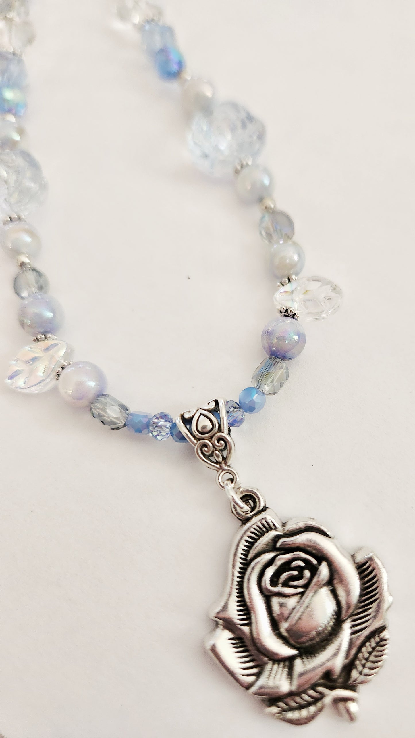 Silver rose and blue whimsical gemstone necklace