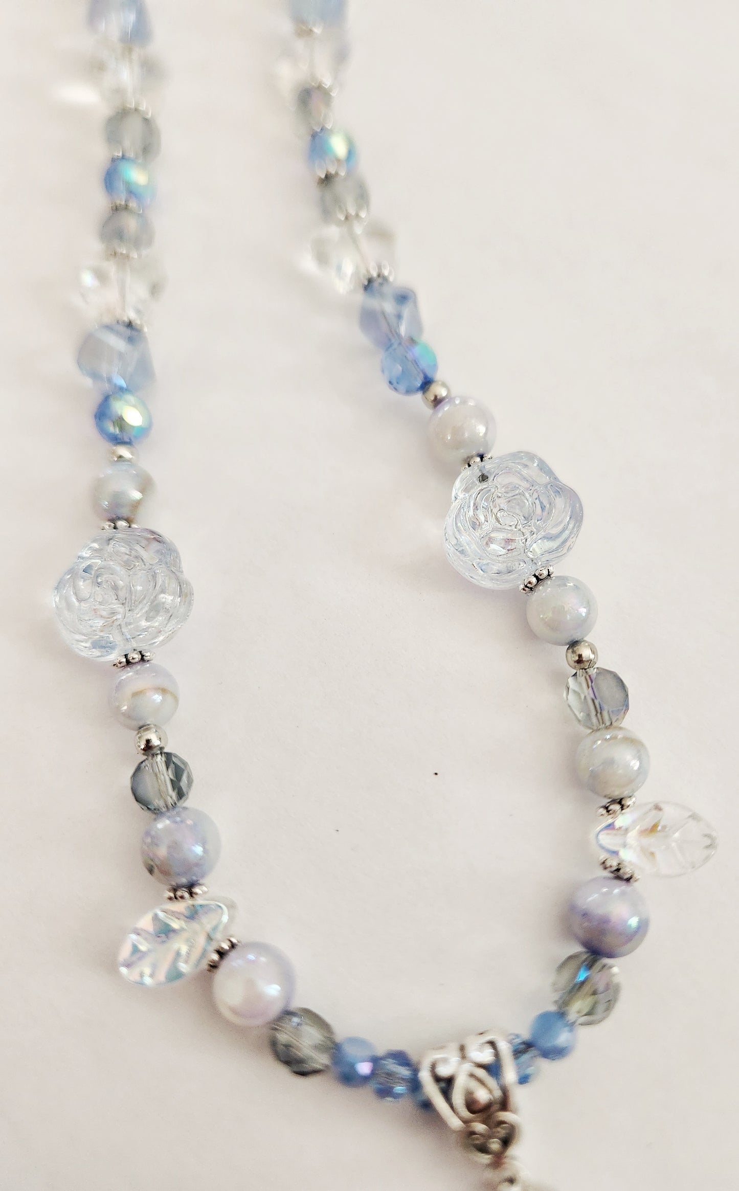 Silver rose and blue whimsical gemstone necklace