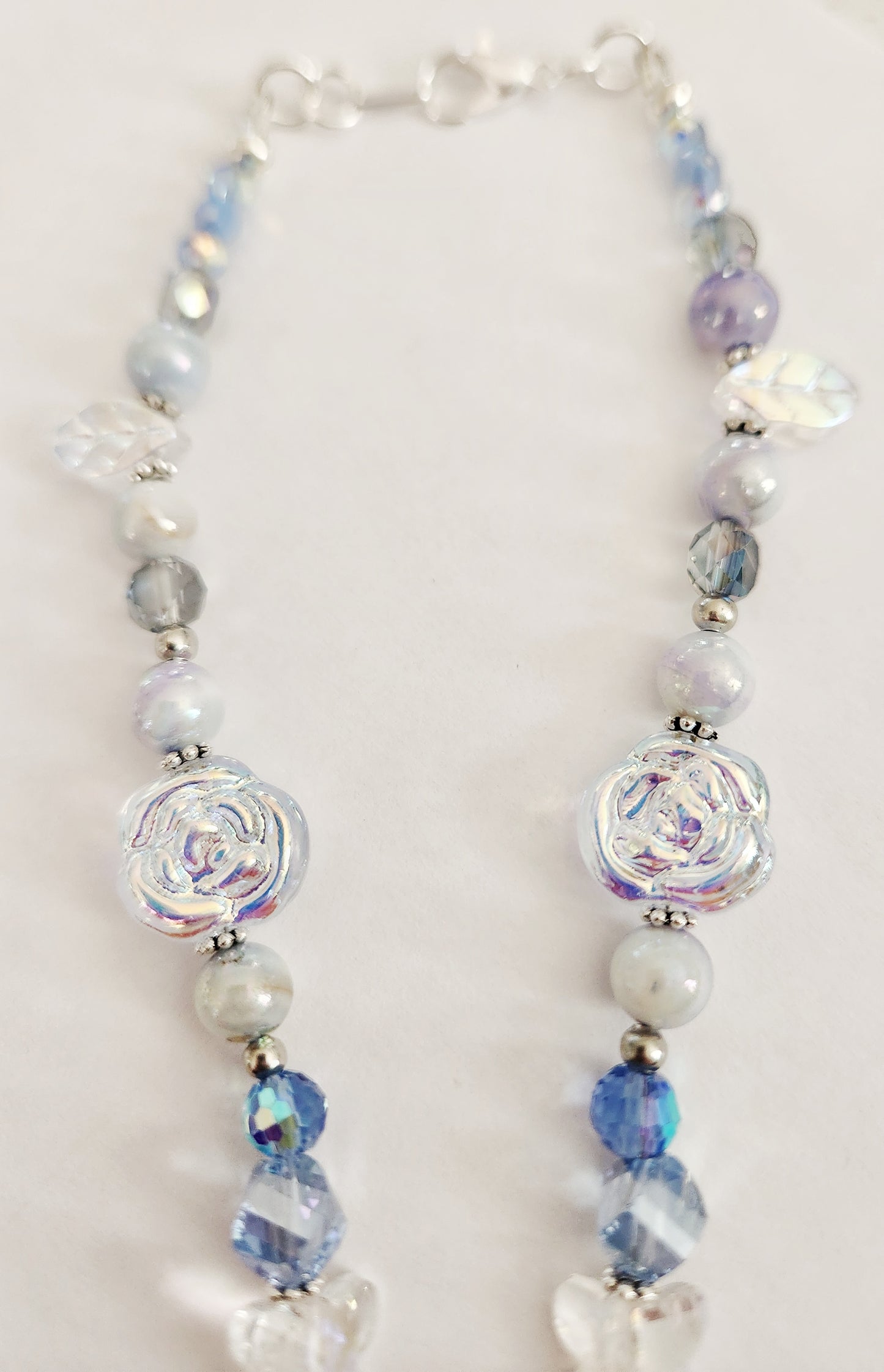 Silver rose and blue whimsical gemstone necklace