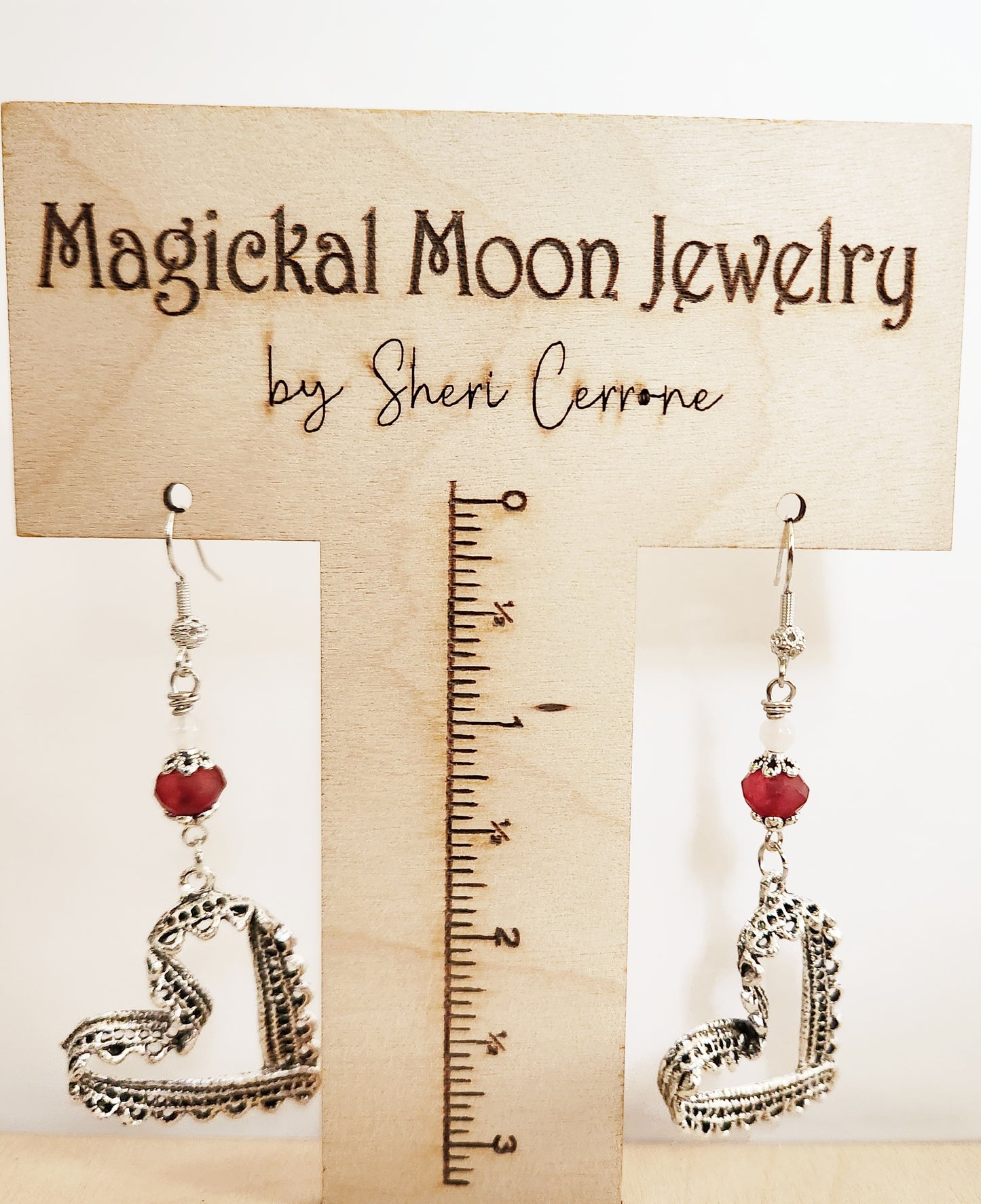 Silver ribbon heart dangle earrings