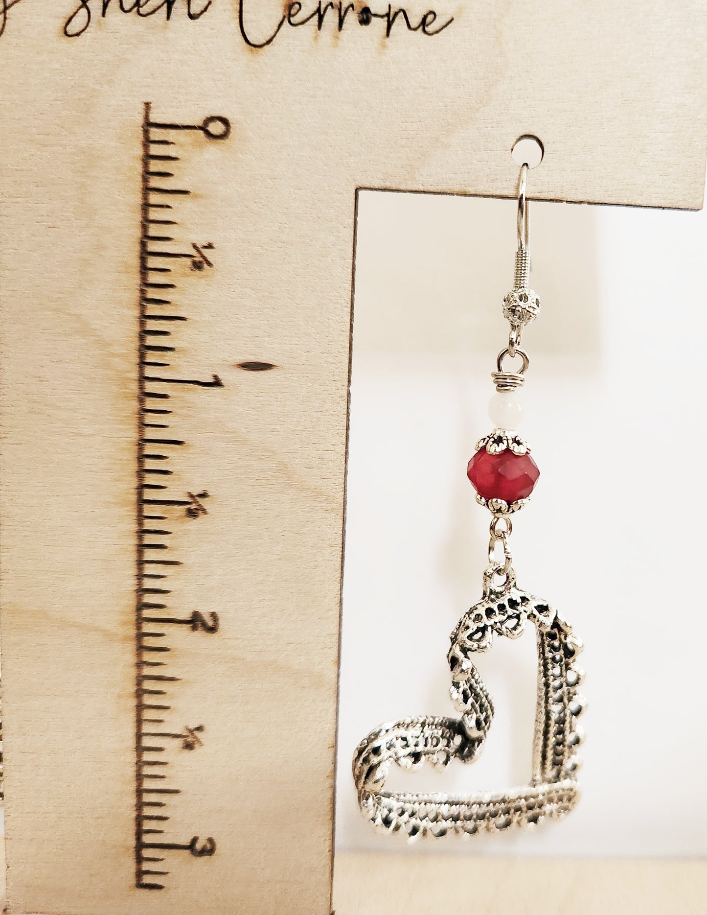 Silver ribbon heart dangle earrings