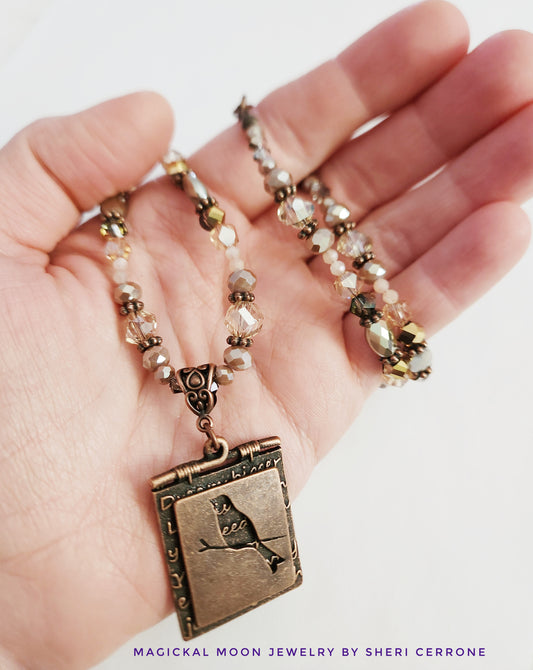 Copper bird and Peach Moonstone necklace