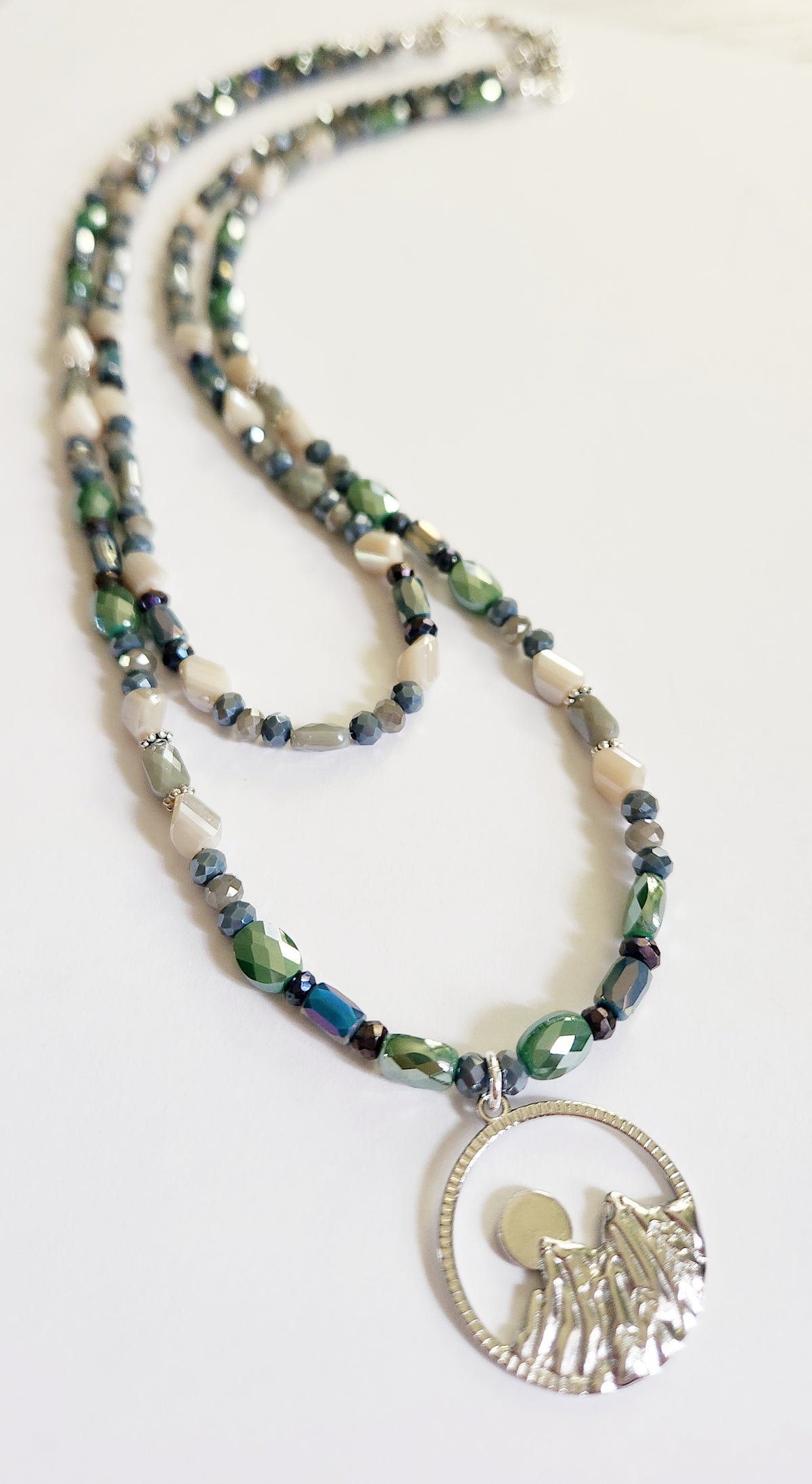 Silver mountain and moon pendant double strand necklace with Pyrite gemstones
