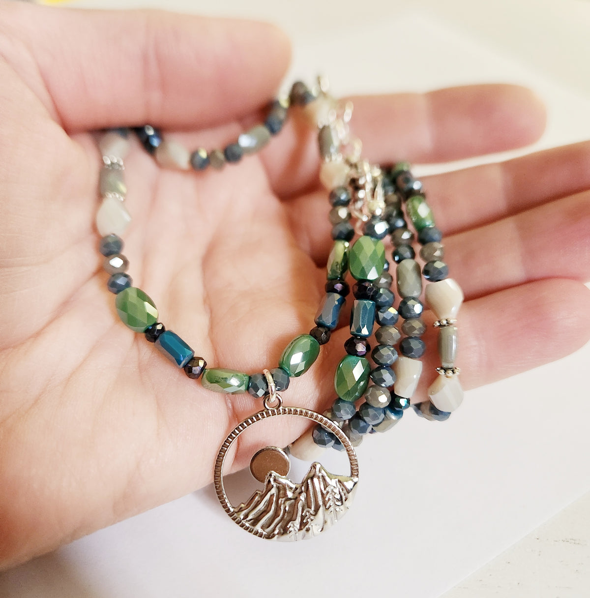 Silver mountain and moon pendant double strand necklace with Pyrite gemstones