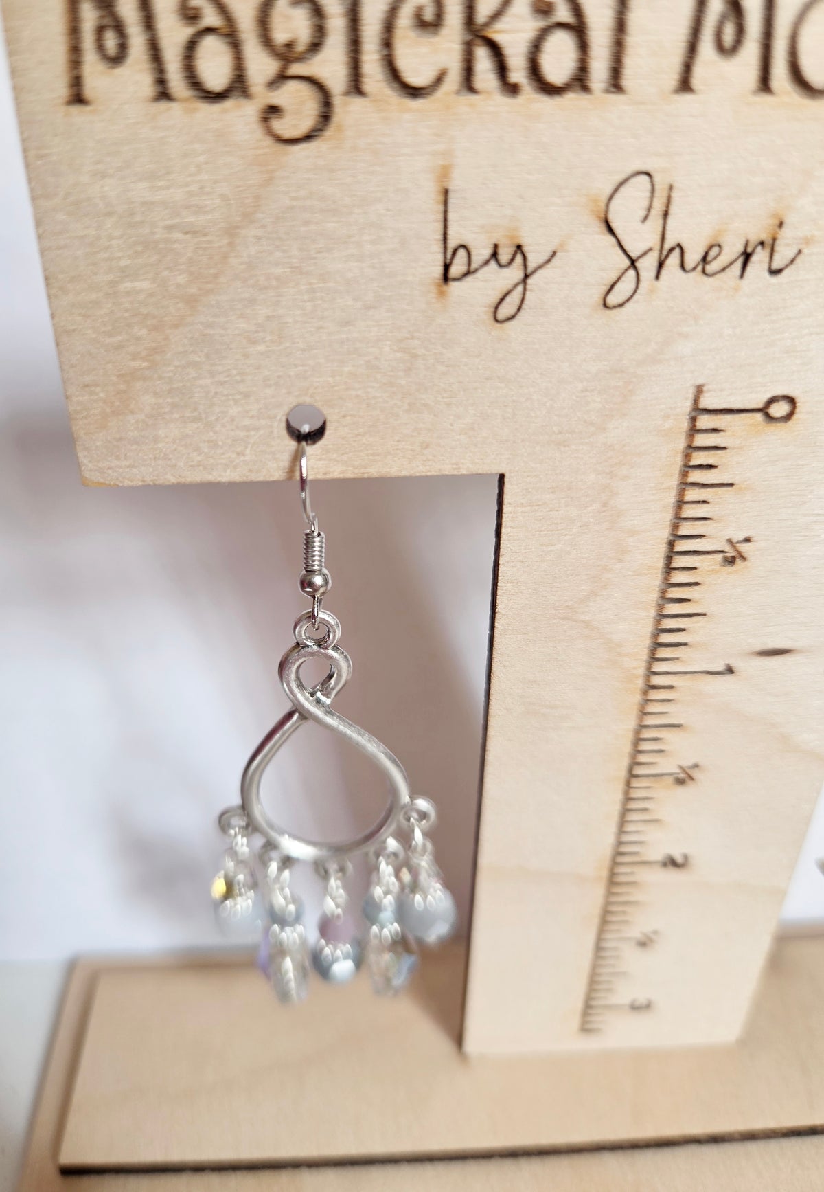Silver teardrop beaded star chandelier earrings